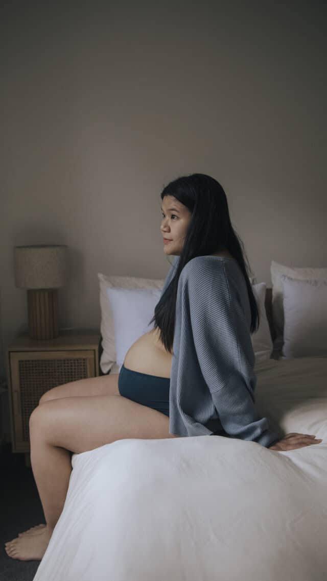 Pregnant woman on bed waiting to be induced