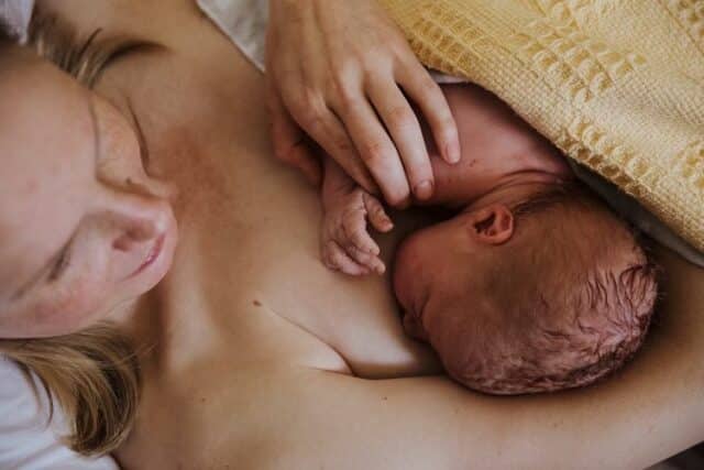 Breast feeding with mastitis signs and symptoms